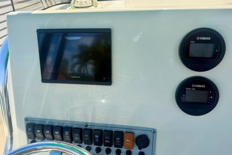Slide: The Image of Dashboard of 2023 Key West 239 FS boat with Garmin and Yamaha displays. - 13