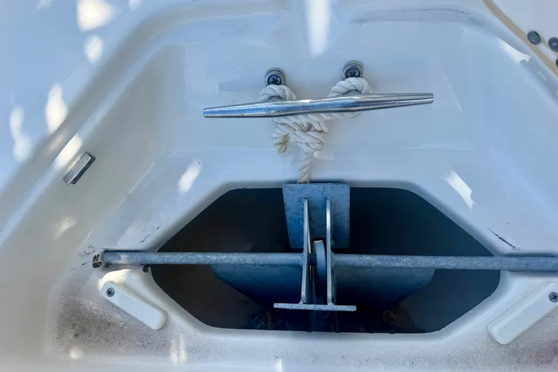 Slide: The Image of Anchor compartment of 2023 Key West 239 FS boat with rope and cleat. - 15