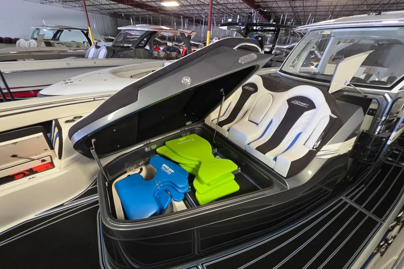 Slide: The Image of 2021 MTI 42 v boat with open storage compartment and colorful life jackets. - 17