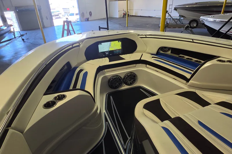 Slide: The Image of Interior of a 2021 MTI 42 v boat with modern seating and navigation display. - 13