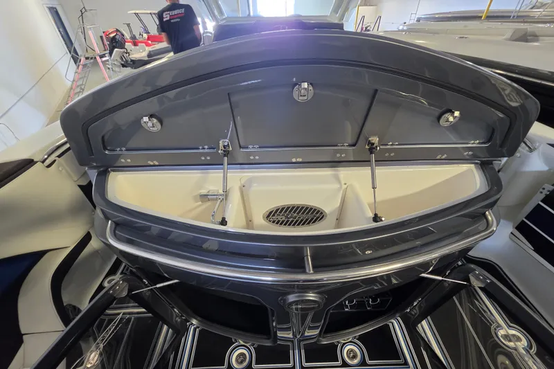 Slide: The Image of Open storage compartment on 2021 MTI 42 v boat, showcasing sleek design and functionality. - 10