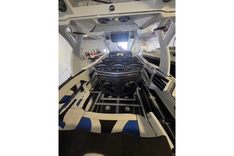 Slide: The Image of Interior of a 2021 MTI 42 v boat, featuring modern design and advanced controls. - 5