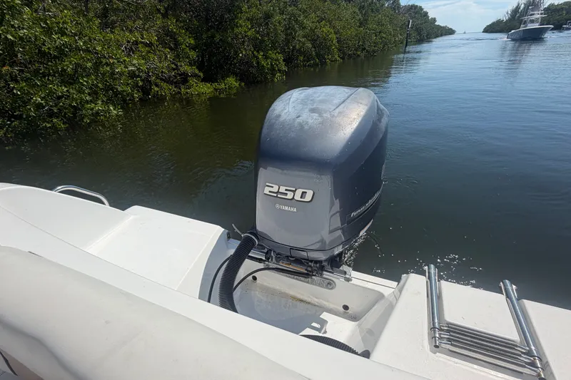 Slide: The Image of 2013 Sportsman Heritage 229 Center Console with Yamaha 250 engine on calm water. - 22