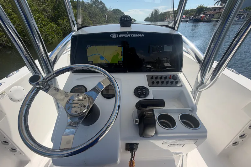 Slide: The Image of Center console of a 2013 Sportsman Heritage 229 boat with navigation display. - 12