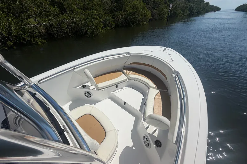 Slide: The Image of 2013 Sportsman Heritage 229 Center Console boat on a calm waterway. - 10