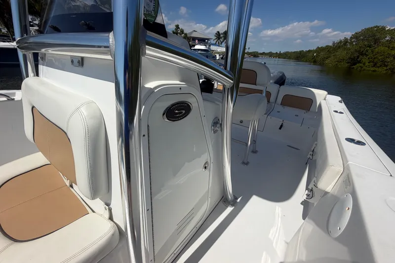 Slide: The Image of 2013 Sportsman Heritage 229 Center Console boat interior with seating and console details. - 17