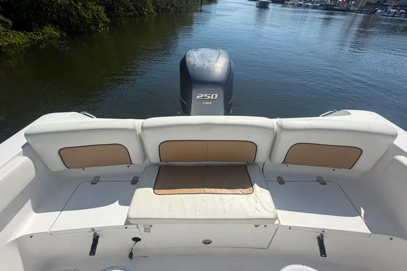 Slide: The Image of 2013 Sportsman Heritage 229 Center Console boat with Yamaha 250 engine on calm water. - 21