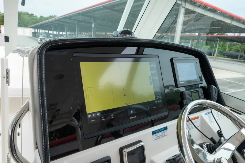 Slide: The Image of Helm of 2020 World Cat 320 DC with Garmin navigation display and steering wheel. - 16