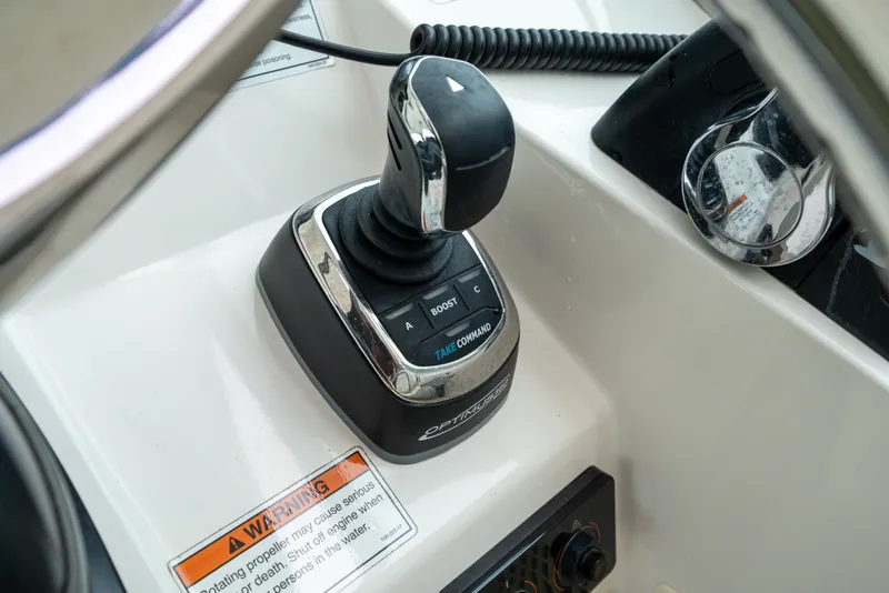 Slide: The Image of Joystick control on 2020 World Cat 320 DC boat dashboard with warning label. - 17