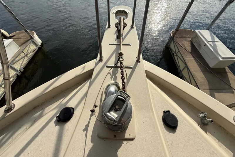 Slide: The Image of Bow of 1988 Californian 45 Motor Yacht with anchor chain and water reflections. - 9