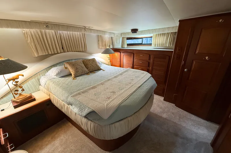 Slide: The Image of Luxurious bedroom interior of 1988 Californian 45 Motor Yacht with elegant wood finishes. - 27