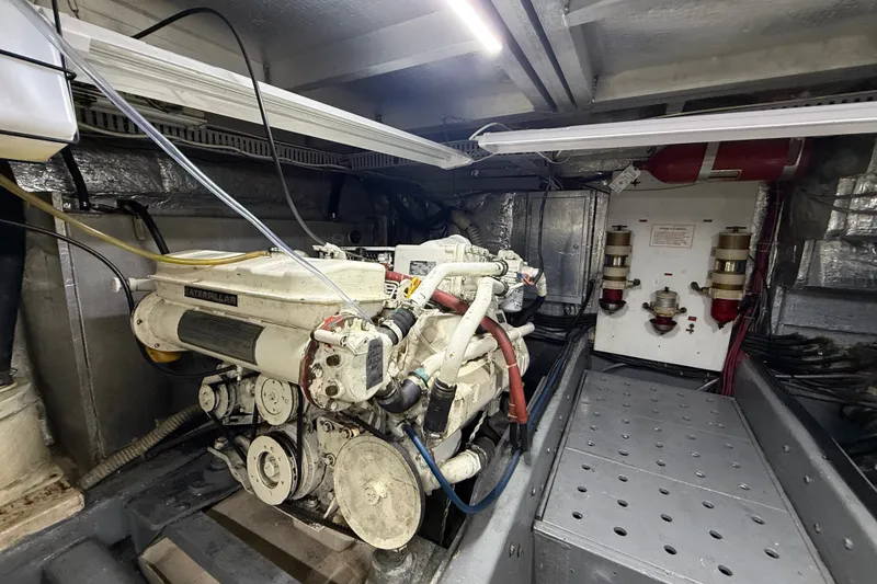 Slide: The Image of Engine room of a 1988 Californian 45 Motor Yacht with visible machinery and components. - 31