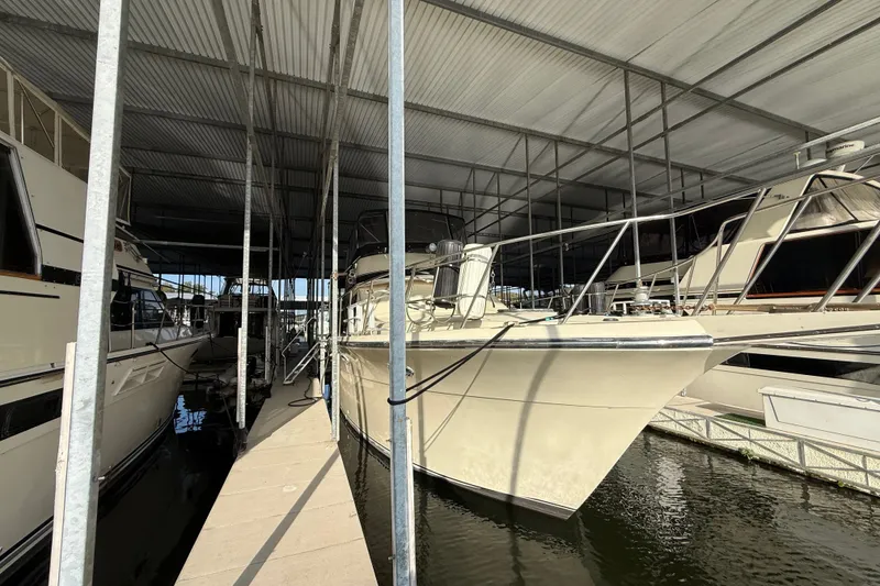 Slide: The Image of 1988 Californian 45 Motor Yacht docked in covered marina, side view. - 14