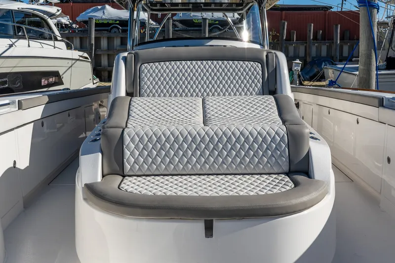 Slide: The Image of Luxurious seating on 2022 Valhalla V-46 boat, featuring diamond-stitched upholstery. - 45