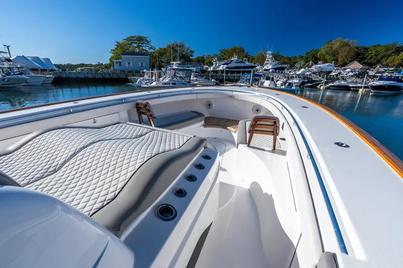 Slide: The Image of Luxurious 2022 Valhalla V-46 boat interior at marina, featuring plush seating and sleek design. - 47