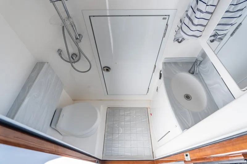 Slide: The Image of 2022 Valhalla V-46 yacht bathroom with shower, sink, and toilet in sleek design. - 41
