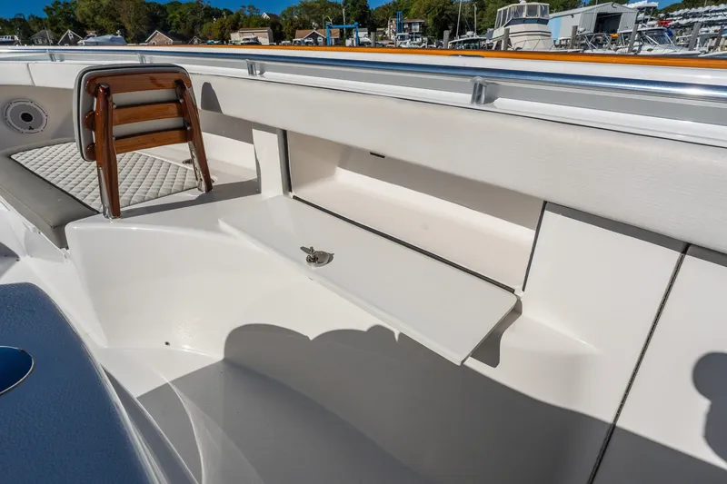 Slide: The Image of 2022 Valhalla V-46 boat interior with seating and storage compartment. - 49