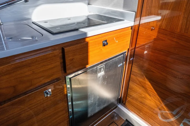 Slide: The Image of Luxurious wooden interior of 2022 Valhalla V-46 yacht kitchen area. - 38