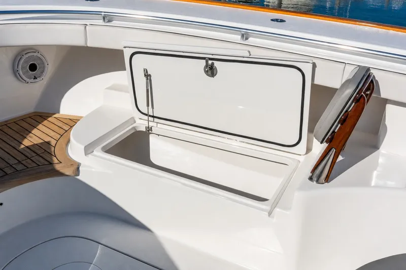 Slide: The Image of 2022 Valhalla V-46 boat storage compartment with teak accents and sleek design. - 55