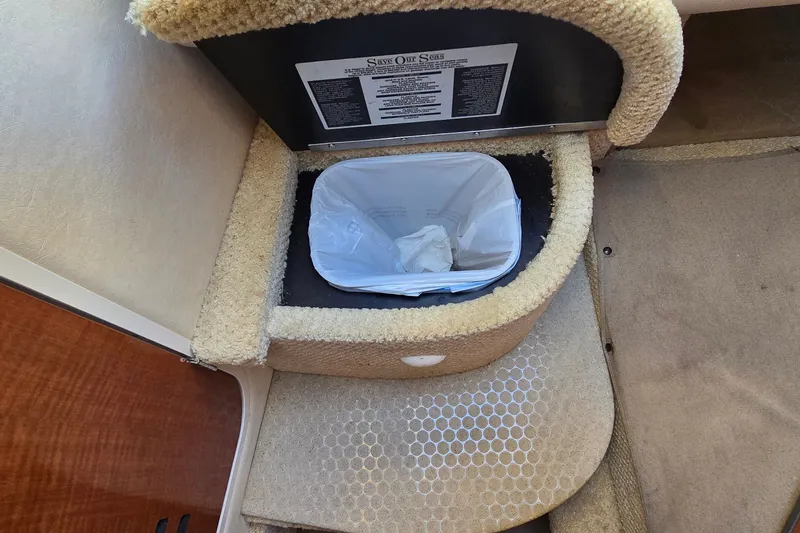 Slide: The Image of Interior of 2005 Sea Ray Sundancer 260 with built-in trash bin. - 16