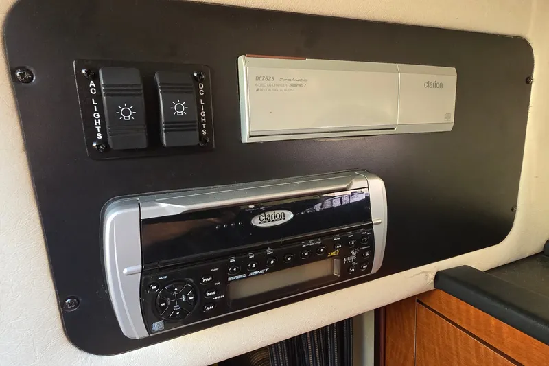 Slide: The Image of Control panel with Clarion audio system in 2005 Sea Ray Sundancer 260 boat. - 17