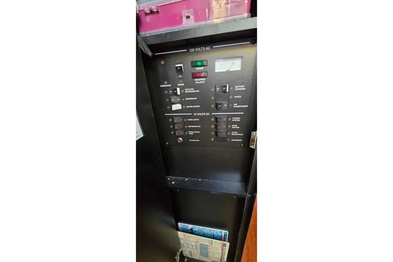 Slide: The Image of Electrical control panel on a 2005 Sea Ray Sundancer 260 boat. - 21