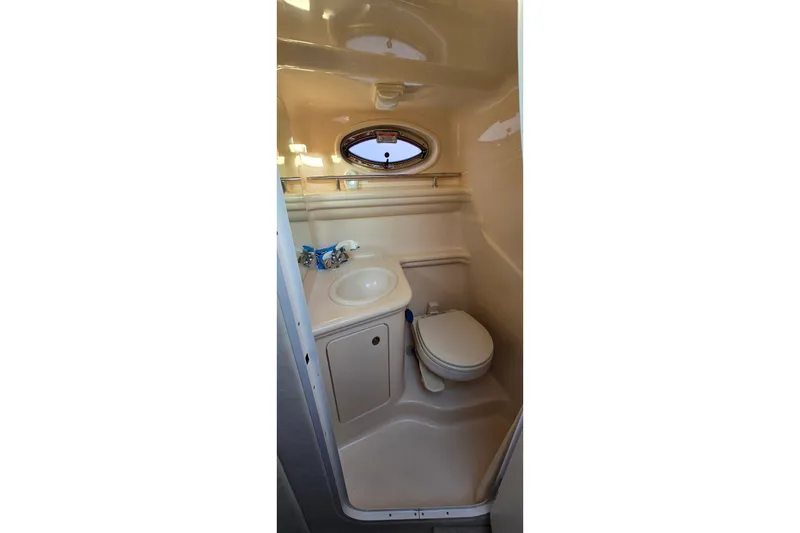 Slide: The Image of Compact bathroom in 2005 Sea Ray Sundancer 260 boat with sink and toilet. - 20