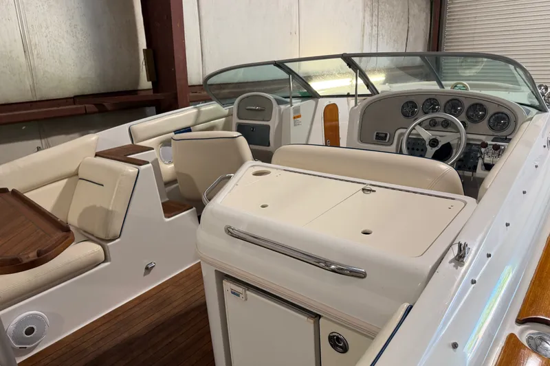 Slide: The Image of 2003 Chris-Craft Launch 28 boat interior with elegant seating and classic dashboard design. - 7