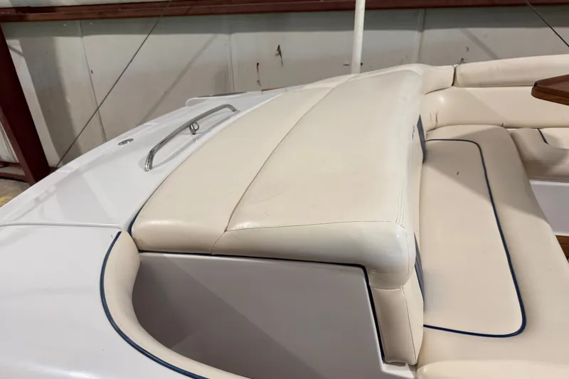 Slide: The Image of 2003 Chris-Craft Launch 28 boat with white leather seating and stainless steel handle. - 8