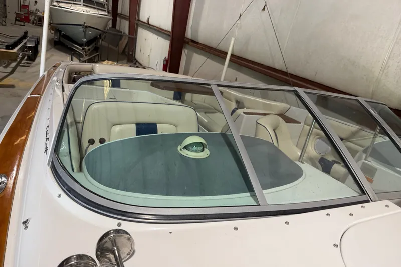 Slide: The Image of 2003 Chris-Craft Launch 28 boat interior with windshield, stored indoors. - 2