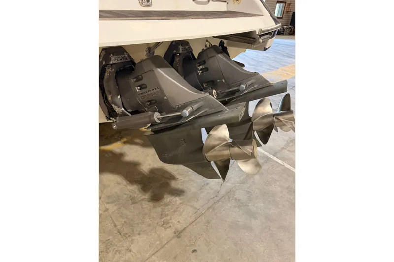 Slide: The Image of 2003 Chris-Craft Launch 28 boat with dual Volvo Penta outdrives in a garage. - 11