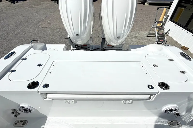 Slide: The Image of 2027 Sea Hunt BX28 boat with dual outboard motors, featuring a spacious deck layout. - 4