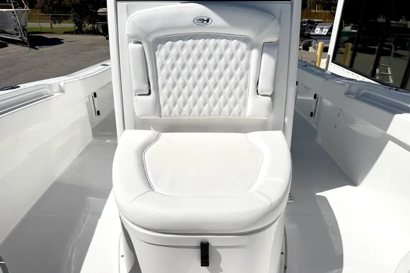 Slide: The Image of Luxurious white seating on 2027 Sea Hunt BX28 boat, featuring diamond-pattern upholstery. - 23