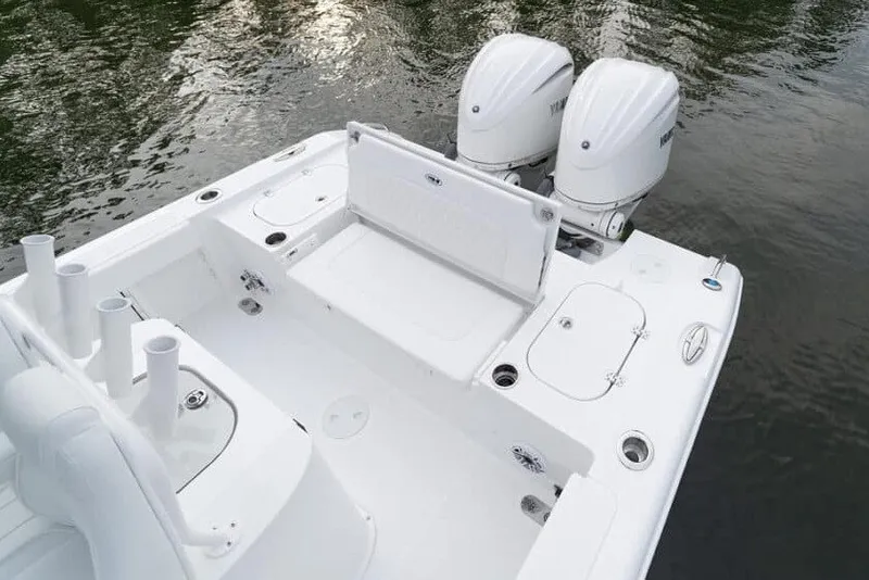 Slide: The Image of Manufacturer Provided Image: 2027 Sea Hunt BX28 boat with dual engines, spacious deck, and seating on calm water. - 38