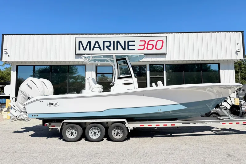 Slide: The Image of 2027 Sea Hunt BX28 boat on trailer at Marine 360 dealership. - 1