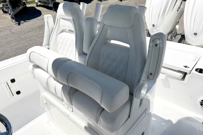 Slide: The Image of 2027 Sea Hunt BX28 boat with luxurious white seating and modern design. - 15
