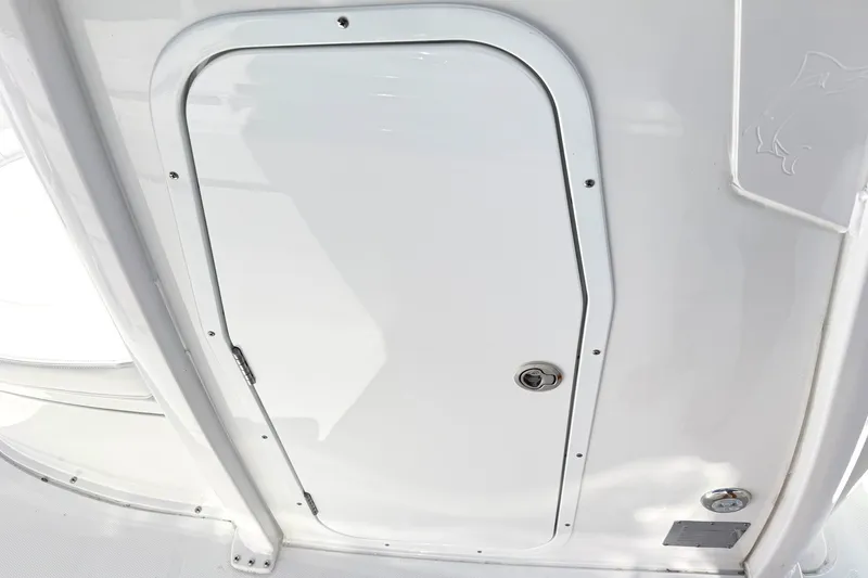 Slide: The Image of White hatch door on 2027 Sea Hunt BX28 boat interior. - 28
