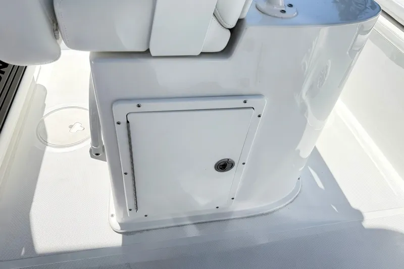 Slide: The Image of White storage compartment on a 2027 Sea Hunt BX28 boat deck. - 17