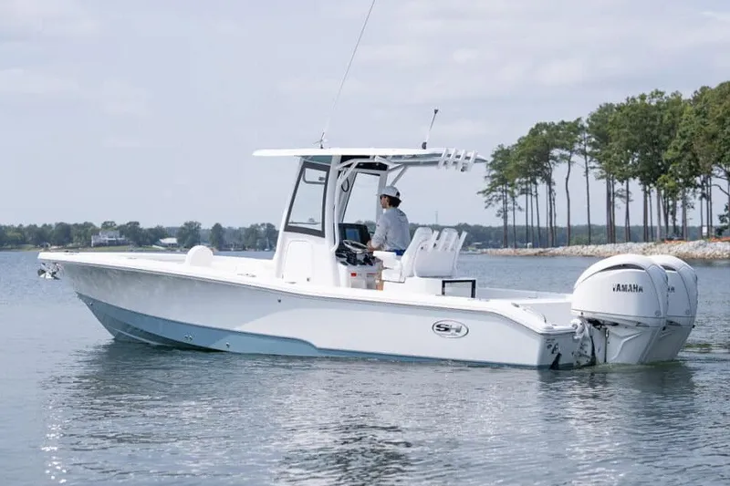 Slide: The Image of Een moderne Sea Hunt BX28 uit 2027 op kalm water met een Yamaha buitenboordmotor. - 32