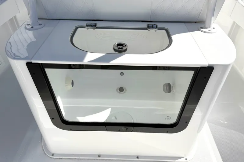 Slide: The Image of Livewell on 2027 Sea Hunt BX28 boat, featuring a transparent lid and sleek design. - 5