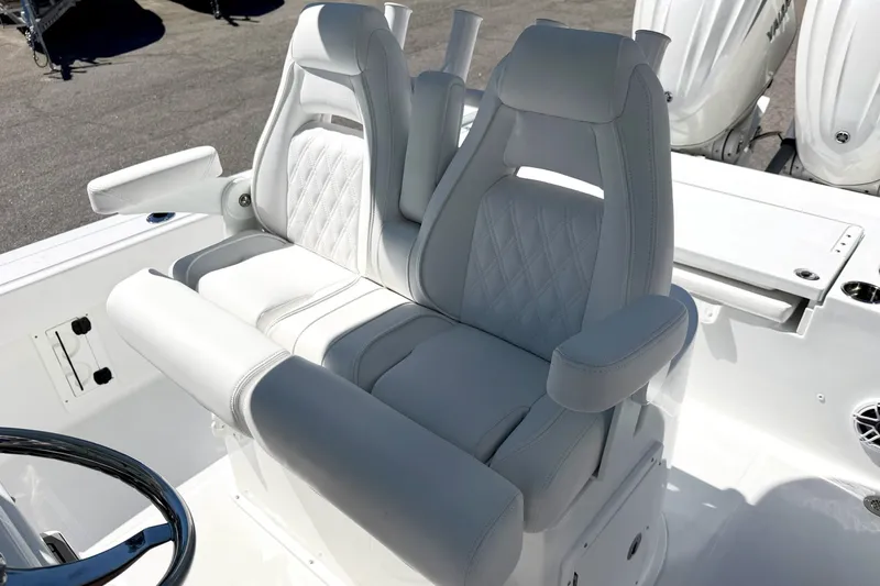 Slide: The Image of Luxury seating on 2027 Sea Hunt BX28 boat, featuring plush white upholstery and ergonomic design. - 16
