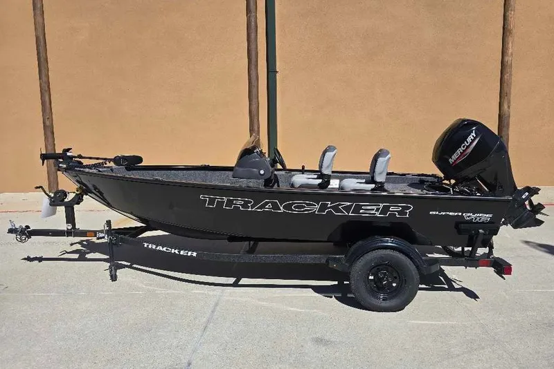 The Image of 2027 Tracker Super Guide V-16 SC fishing boat with Mercury outboard motor on trailer. - 0