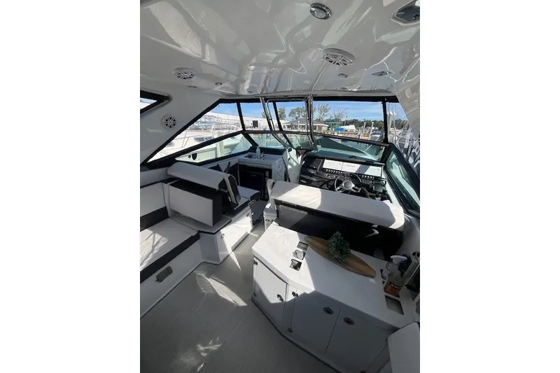 Slide: The Image of 2024 Monterey 378SS Super Sport boat interior with modern helm and seating. - 4