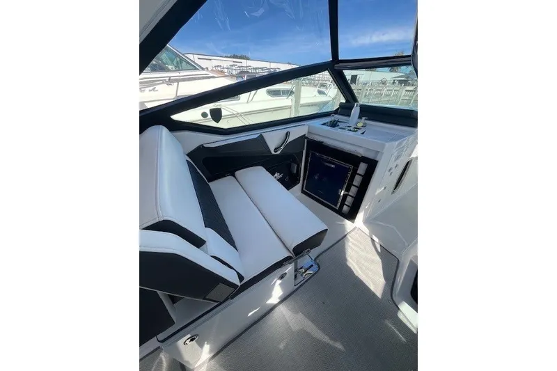 Slide: The Image of 2024 Monterey 378SS Super Sport boat interior with sleek seating and modern dashboard. - 18