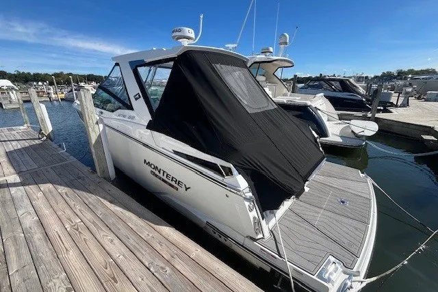 Slide: The Image of 2024 Monterey 378SS Super Sport boat docked at marina under clear blue sky. - 3