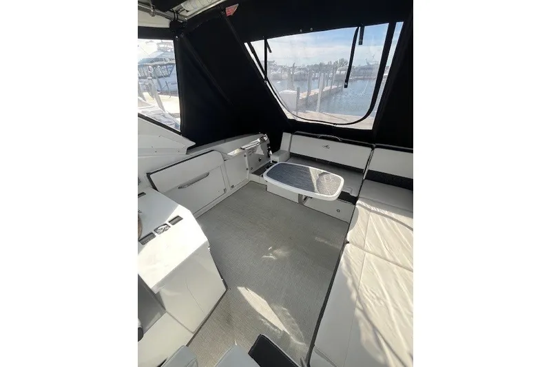 Slide: The Image of Interior of 2024 Monterey 378SS Super Sport boat with seating and table. - 6