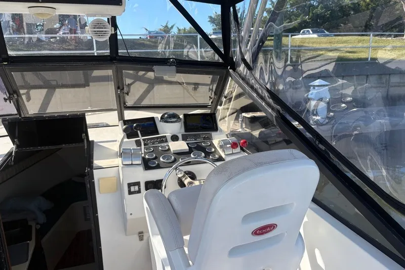 Slide: The Image of Interior view of 1995 Carolina Classic 28 boat cockpit with steering and controls. - 19