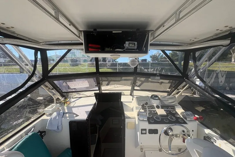 Slide: The Image of Interior view of a 1995 Carolina Classic 28 boat cockpit with navigation equipment. - 14