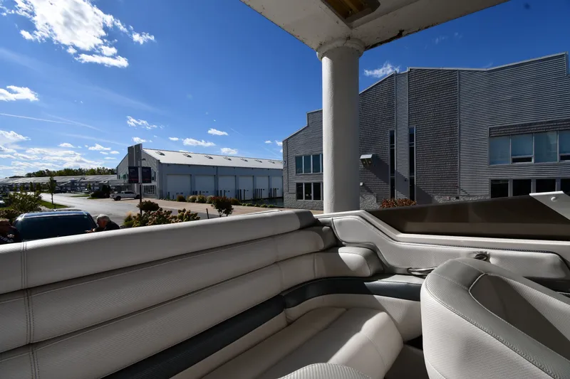 Slide: The Image of Interior view of a 1995 Fountain 24 Competition boat with modern buildings in the background. - 21