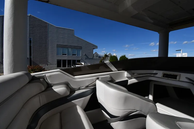 Slide: The Image of Interior of a 1995 Fountain 24 Competition boat with modern seating and exterior view. - 20